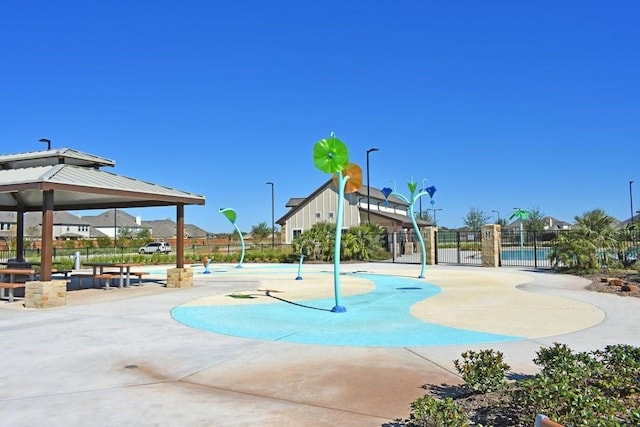 view of home's community featuring a gazebo and fence