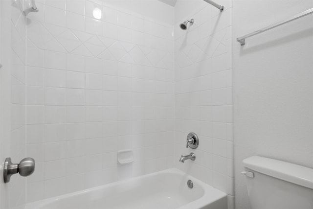 bathroom with toilet and bathtub / shower combination