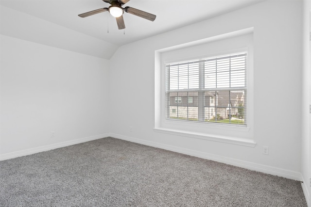 unfurnished room featuring baseboards, carpet, and a ceiling fan