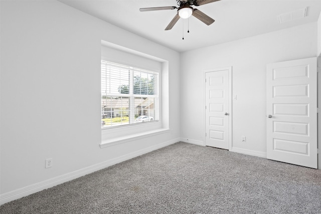 unfurnished bedroom featuring visible vents, ceiling fan, baseboards, and carpet