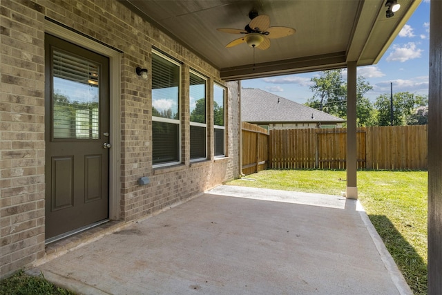 view of patio with a fenced backyard and ceiling fan