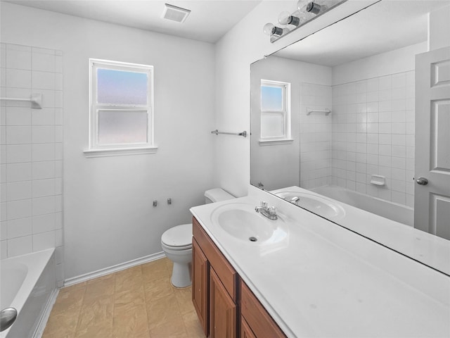 full bath featuring visible vents, toilet, shower / bathtub combination, baseboards, and vanity