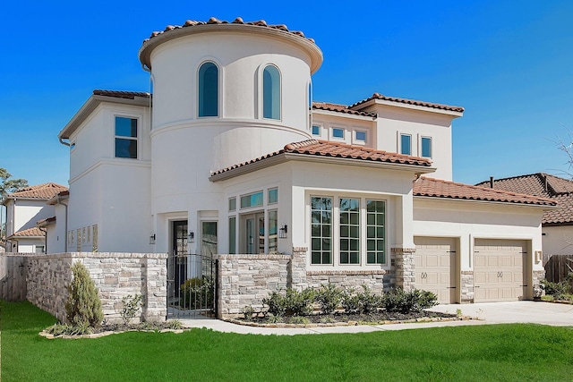 mediterranean / spanish-style home with driveway, stucco siding, a garage, stone siding, and a tile roof