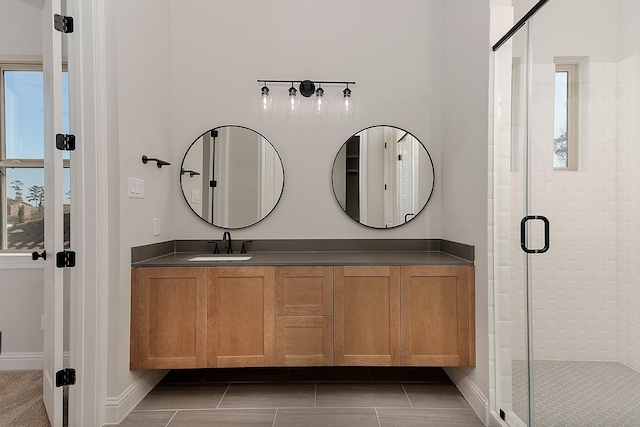 full bathroom with vanity and a stall shower