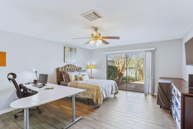 bedroom featuring visible vents, light wood-type flooring, baseboards, and access to outside