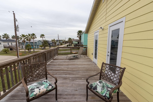 wooden deck featuring a residential view