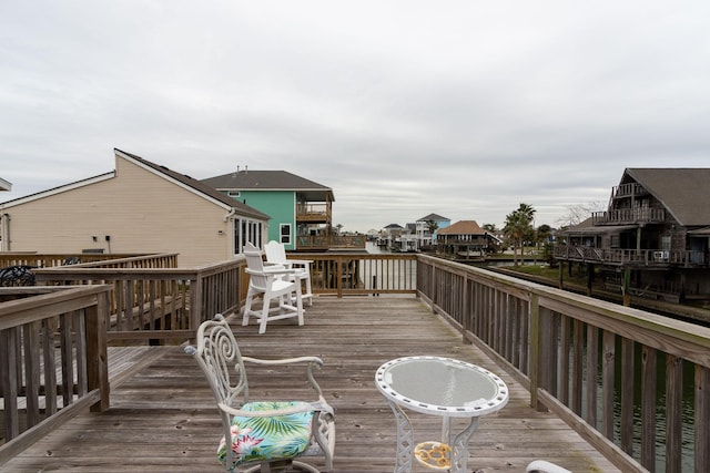 wooden deck with a residential view