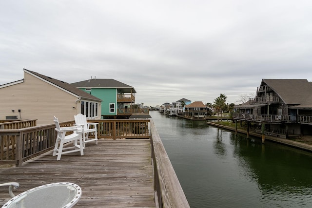 wooden deck featuring a water view