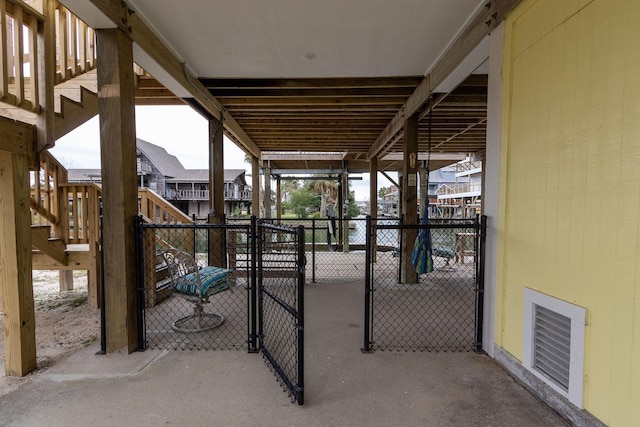 view of patio / terrace featuring visible vents, fence, stairway, and a gate