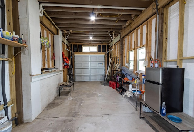 garage with freestanding refrigerator