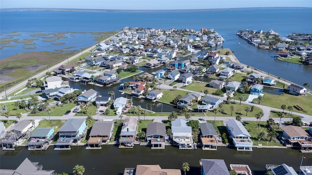 birds eye view of property featuring a water view and a residential view