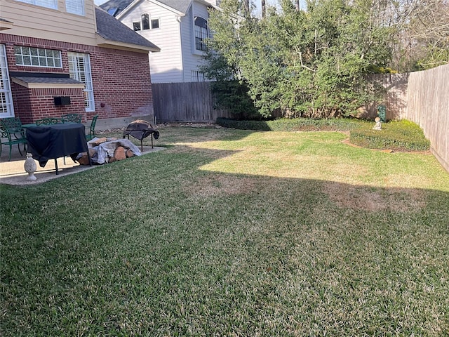 view of yard with a fenced backyard and a patio area