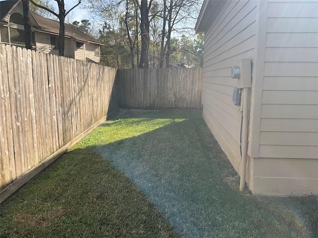 view of yard with a fenced backyard