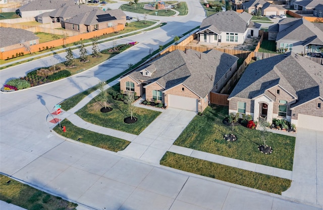 birds eye view of property with a residential view