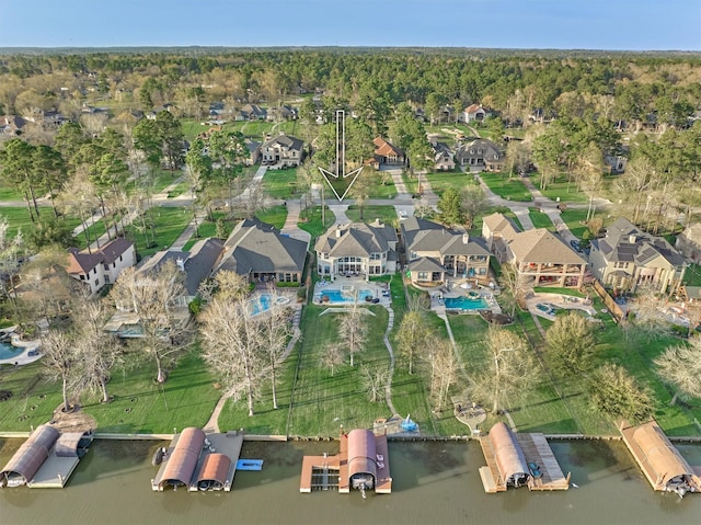 aerial view with a residential view and a water view