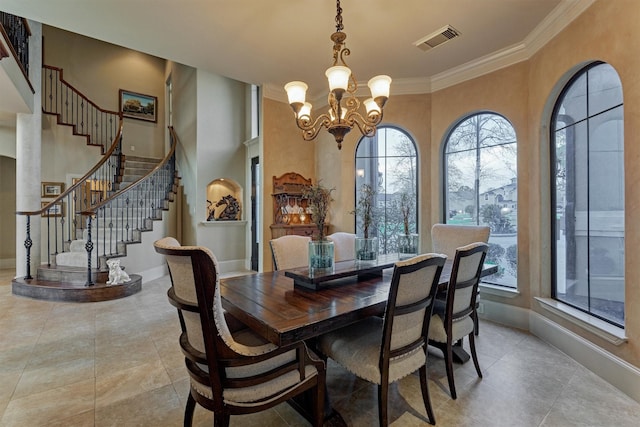 dining space featuring stairway, a notable chandelier, baseboards, and visible vents