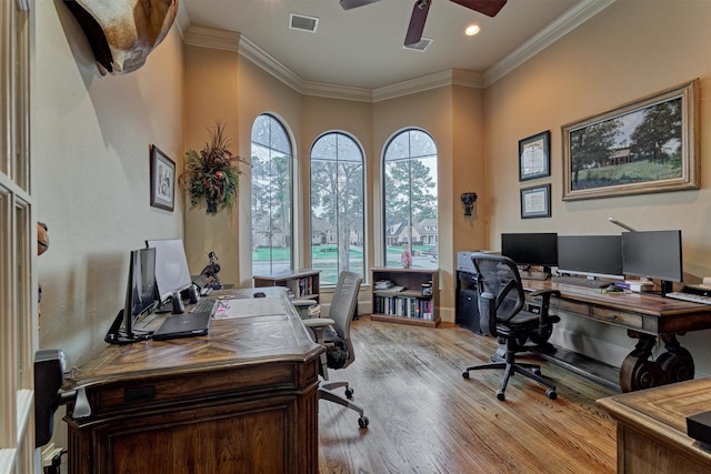 office area featuring a ceiling fan, visible vents, light wood-style flooring, recessed lighting, and ornamental molding