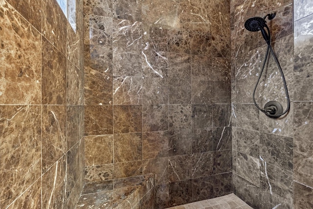 bathroom with tiled shower