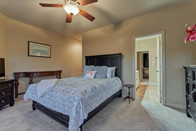 bedroom with light colored carpet, baseboards, and ceiling fan