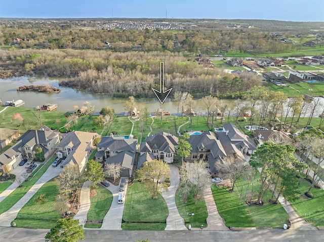 bird's eye view with a residential view and a water view