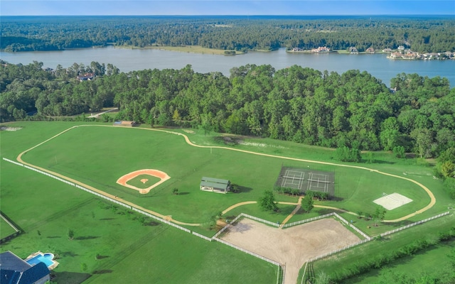 birds eye view of property with a forest view and a water view