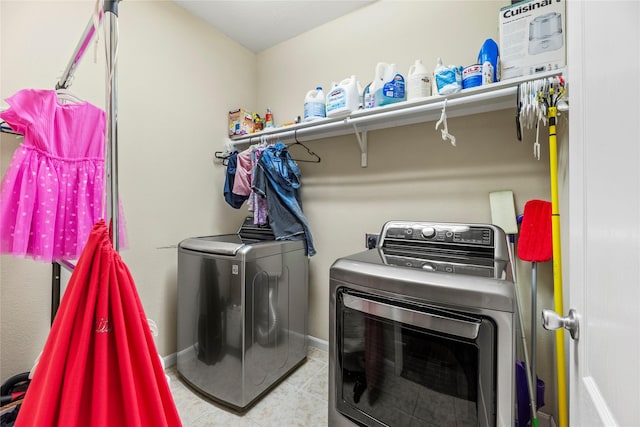 3615 Hawley Creek Dr, Spring, TX 77386 - laundry area with washing machine and dryer, tile patterned floors, and baseboards