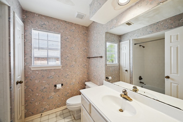 bathroom featuring wallpapered walls, toilet, plenty of natural light, and visible vents