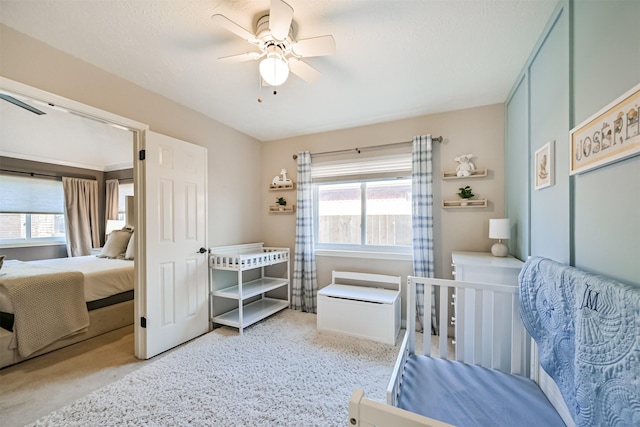 bedroom featuring multiple windows and ceiling fan