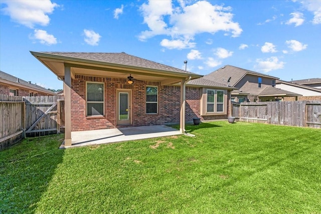 back of house featuring a fenced backyard, brick siding, and a ceiling fan