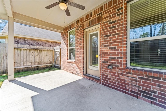 view of patio / terrace featuring a ceiling fan and fence