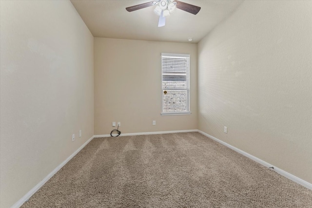 unfurnished room featuring a ceiling fan, baseboards, and carpet floors