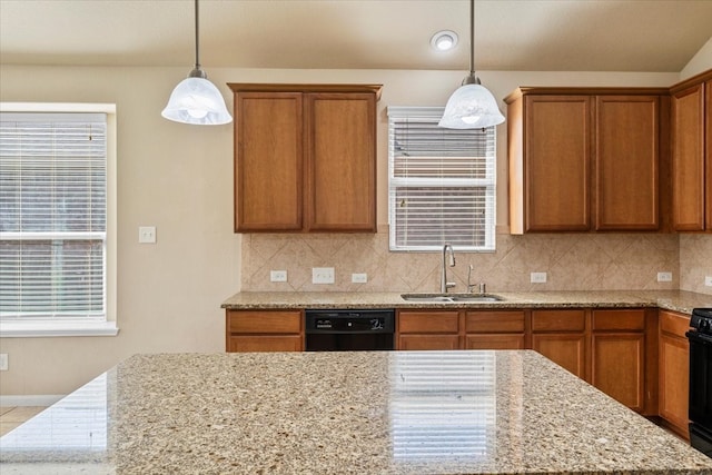 kitchen with black appliances, brown cabinets, tasteful backsplash, and a sink