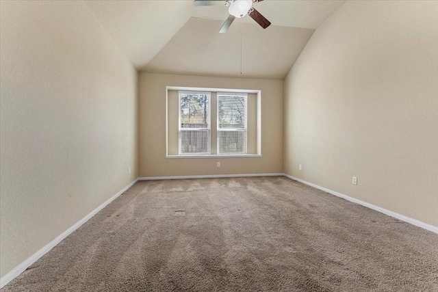 spare room with lofted ceiling, baseboards, carpet floors, and ceiling fan