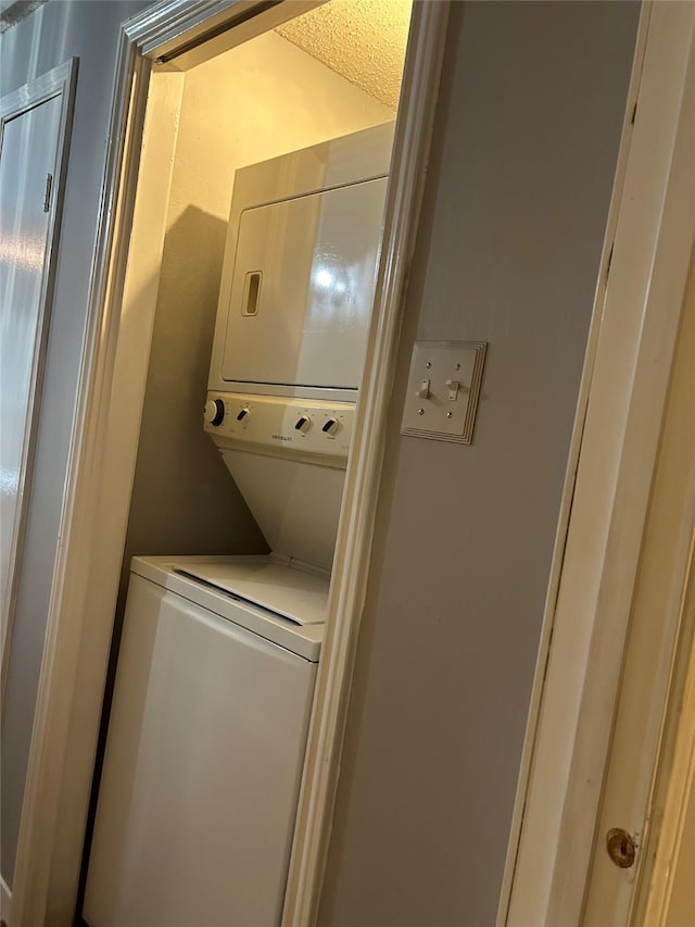 3745 Thistlemont Dr, Houston, TX 77042 - washroom featuring laundry area and stacked washer / dryer