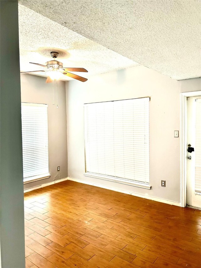 3745 Thistlemont Dr, Houston, TX 77042 - unfurnished room featuring baseboards, wood finished floors, a textured ceiling, and ceiling fan