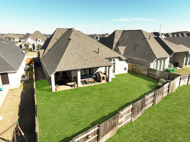 birds eye view of property with a residential view