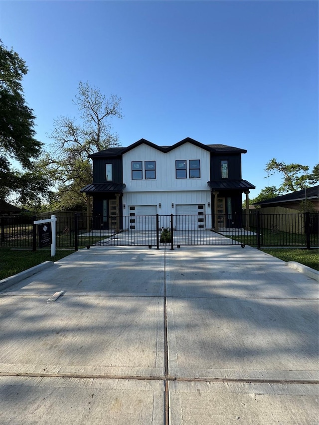 964 Lucky St, Houston, TX 77088 - view of front of property featuring an attached garage, driveway, and metal roof