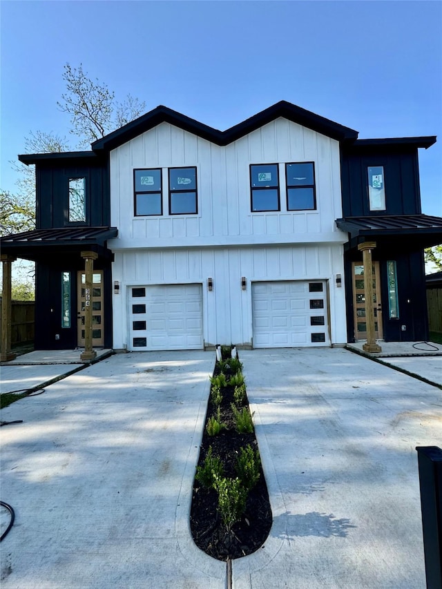 964 Lucky St, Houston, TX 77088 - view of front of home featuring a garage, board and batten siding, concrete driveway, a standing seam roof, and metal roof