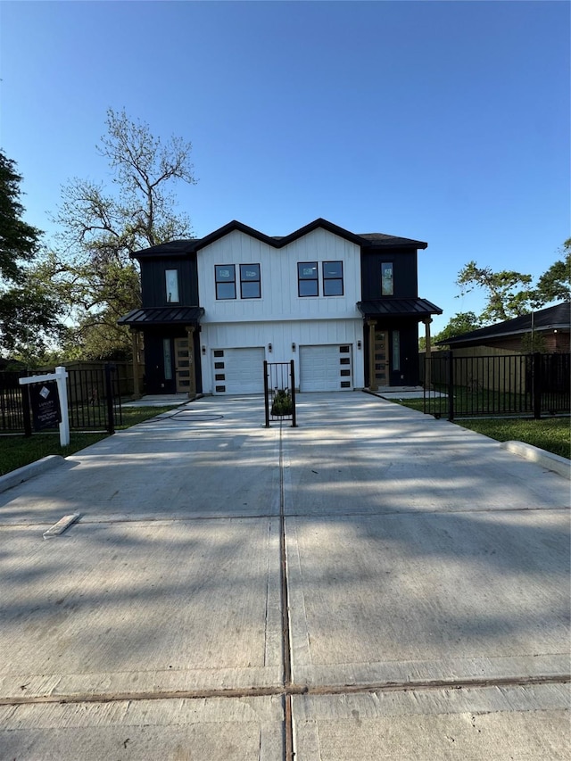 964 Lucky St, Houston, TX 77088 - view of front facade with a garage, driveway, metal roof, and a standing seam roof