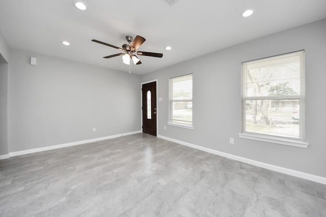 interior space featuring recessed lighting, baseboards, and ceiling fan