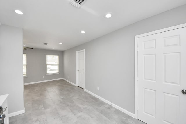 unfurnished room featuring a ceiling fan, visible vents, recessed lighting, and baseboards