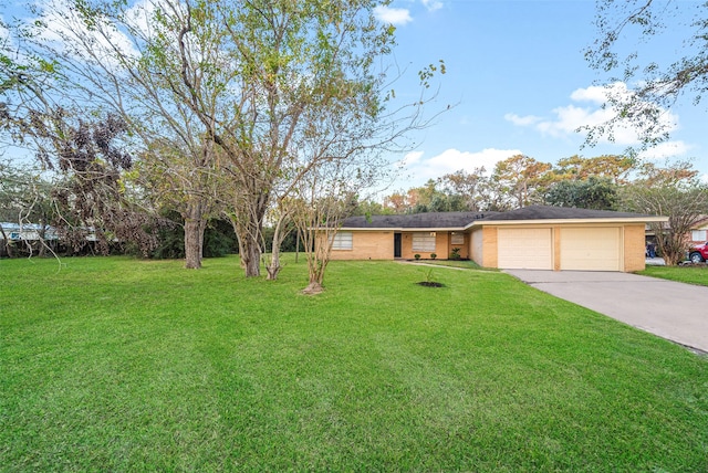 view of front of home featuring concrete driveway, an attached garage, a front lawn, and stucco siding