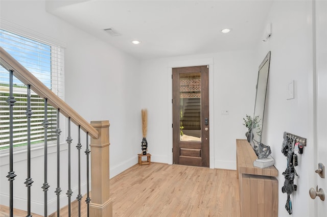 foyer with visible vents, recessed lighting, baseboards, and wood finished floors