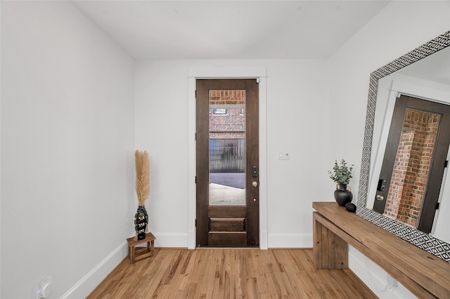 entrance foyer with light wood-style floors and baseboards