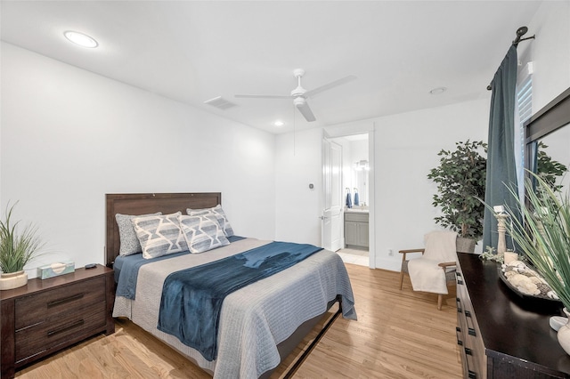 bedroom featuring light wood finished floors, visible vents, recessed lighting, ensuite bathroom, and a ceiling fan