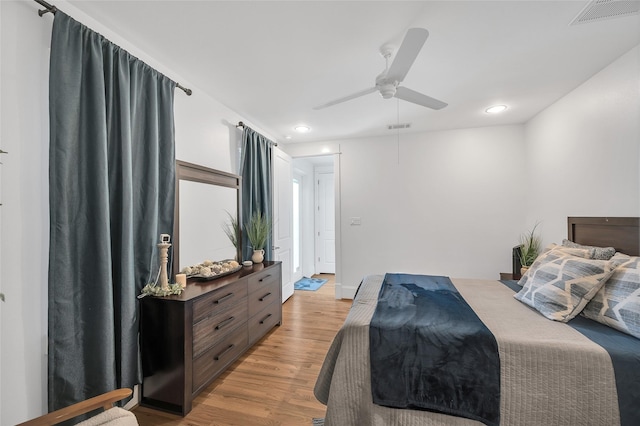 bedroom featuring recessed lighting, visible vents, light wood-style flooring, and a ceiling fan