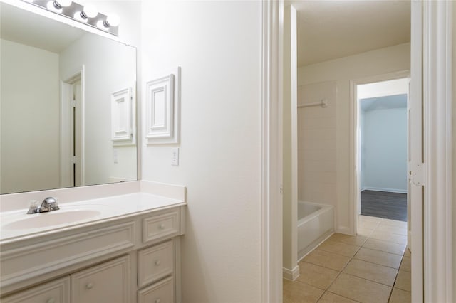 bathroom with tile patterned floors and vanity