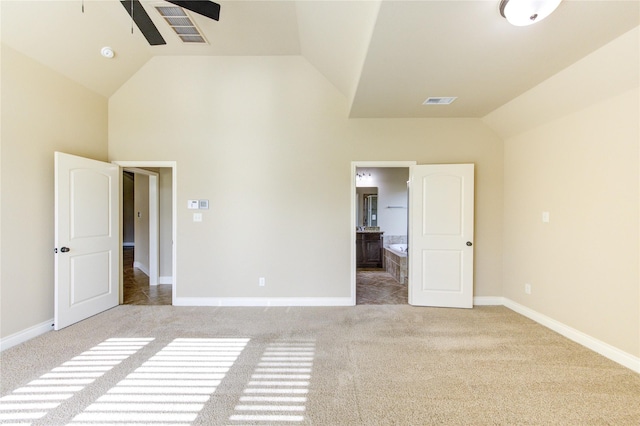 unfurnished bedroom with visible vents, connected bathroom, baseboards, and carpet