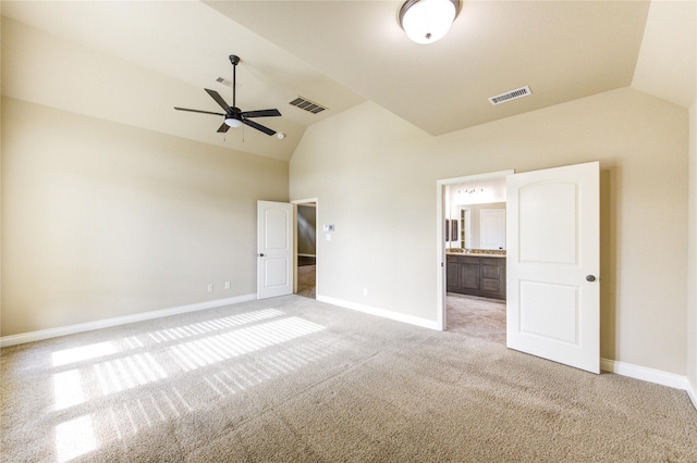 unfurnished bedroom with visible vents, baseboards, and lofted ceiling