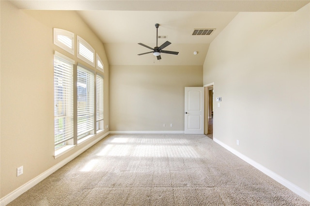 unfurnished room featuring plenty of natural light, a ceiling fan, visible vents, and carpet floors